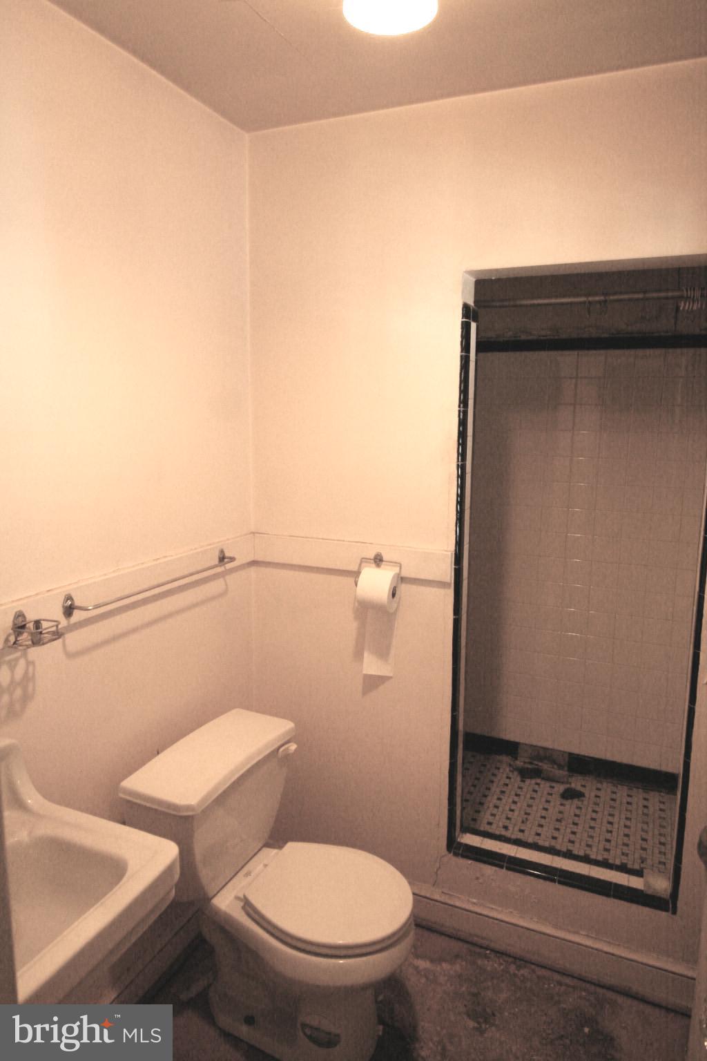 6510 16th Street Northwest Washington, DC 20012 - Photo 17 of 32 a bathroom with a toilet and a shower