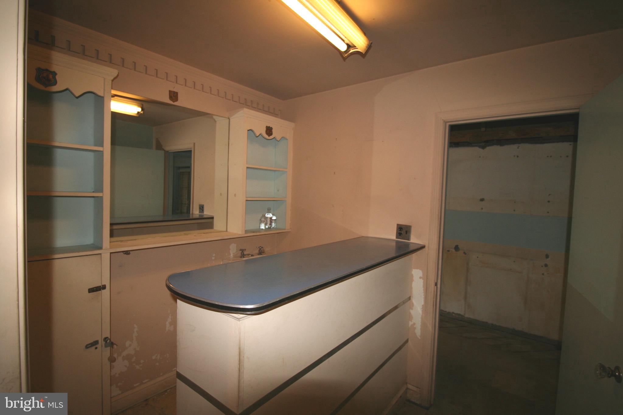 6510 16th Street Northwest Washington, DC 20012 - Photo 29 of 32 a bathroom with a sink and a mirror