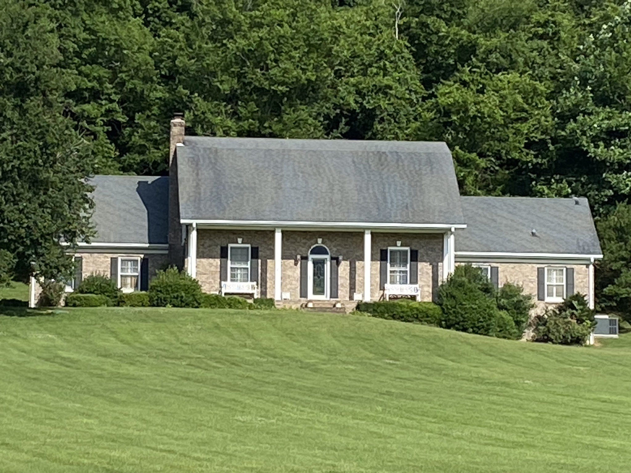 7310 Caney Fork Road Fairview, TN 37062 - Photo 1 of 1 a aerial view of a house next to a big yard and large trees