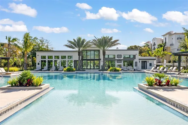 a view of swimming pool with outdoor seating
