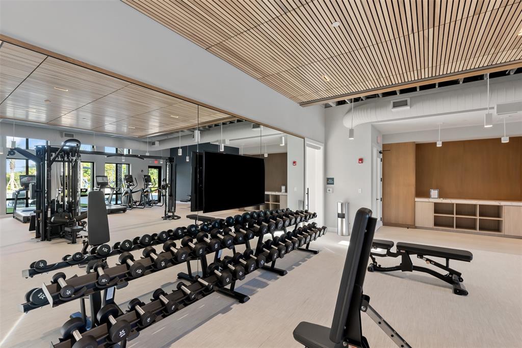 22974 Hillshire Road Boca Raton, FL 33433 - Photo 23 of 24 a room with gym equipment and a large window