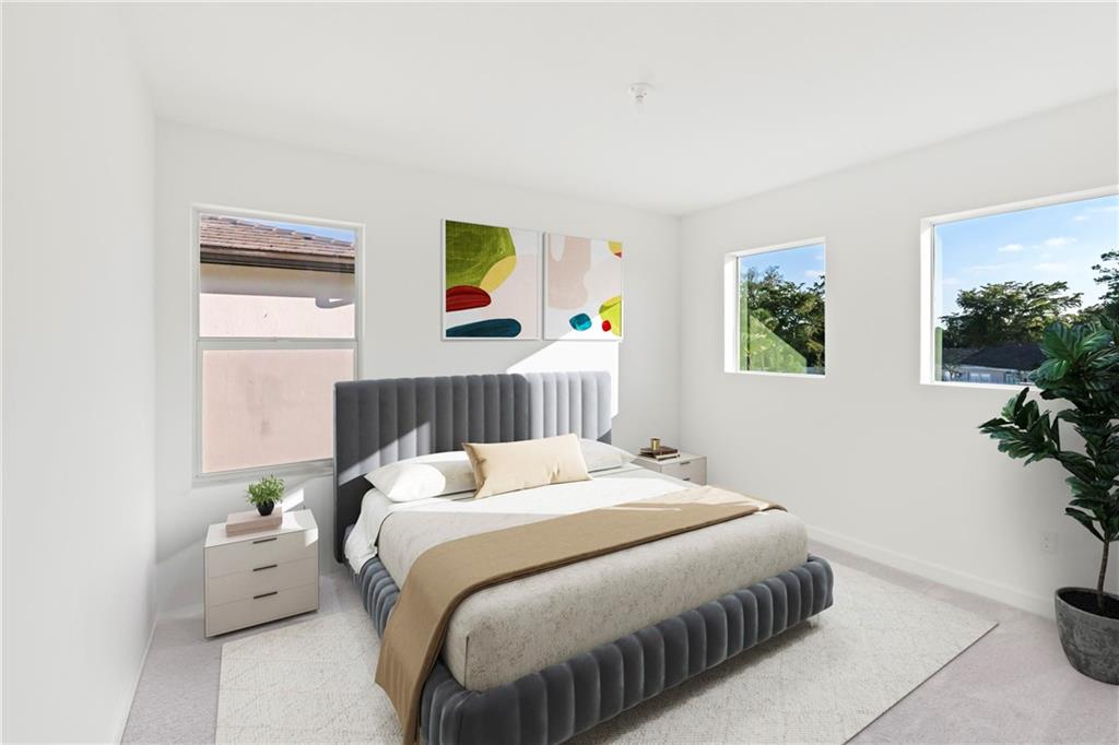 22974 Hillshire Road Boca Raton, FL 33433 - Photo 3 of 24 a bedroom with a bed and a painting on the wall