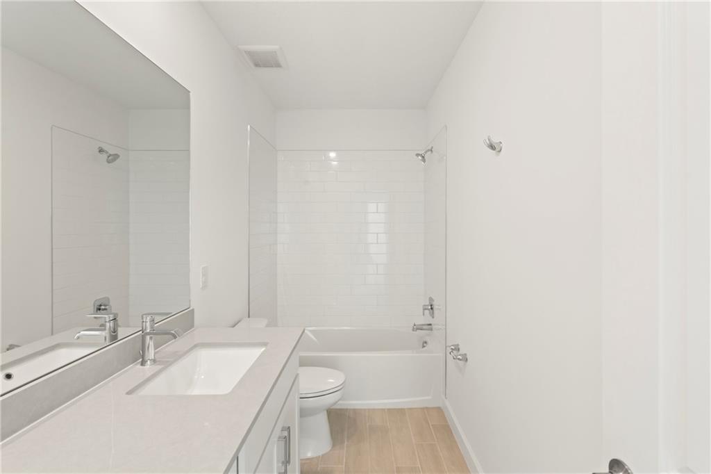 22974 Hillshire Road Boca Raton, FL 33433 - Photo 6 of 24 a bathroom with a sink a toilet and shower