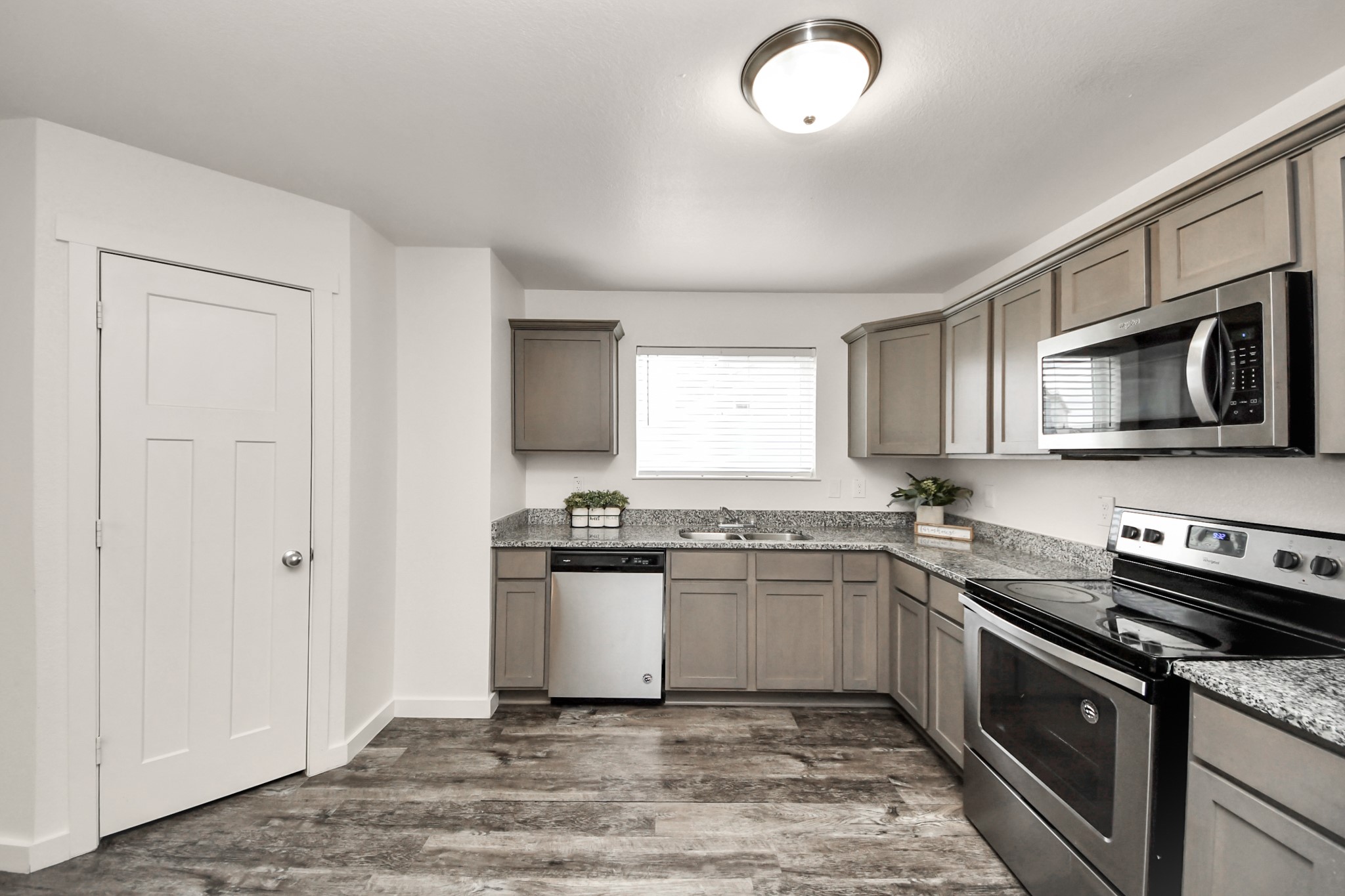 21155 Gosling Road, Unit 40 Spring, TX 77388 - Photo 11 of 33 a kitchen with a sink stove and microwave