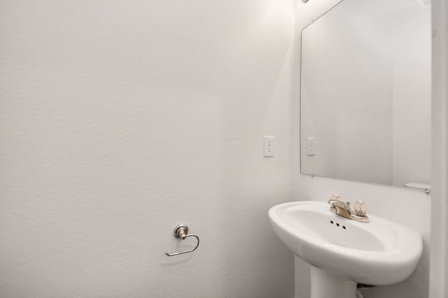 a bathroom with a sink and mirror