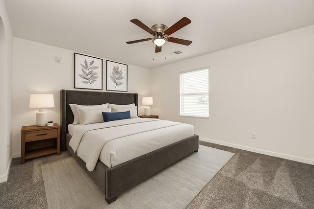 a bedroom with a bed and window