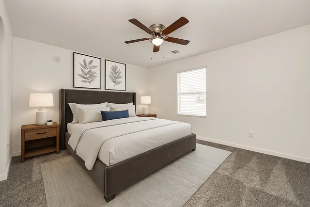 a bedroom with a bed and window