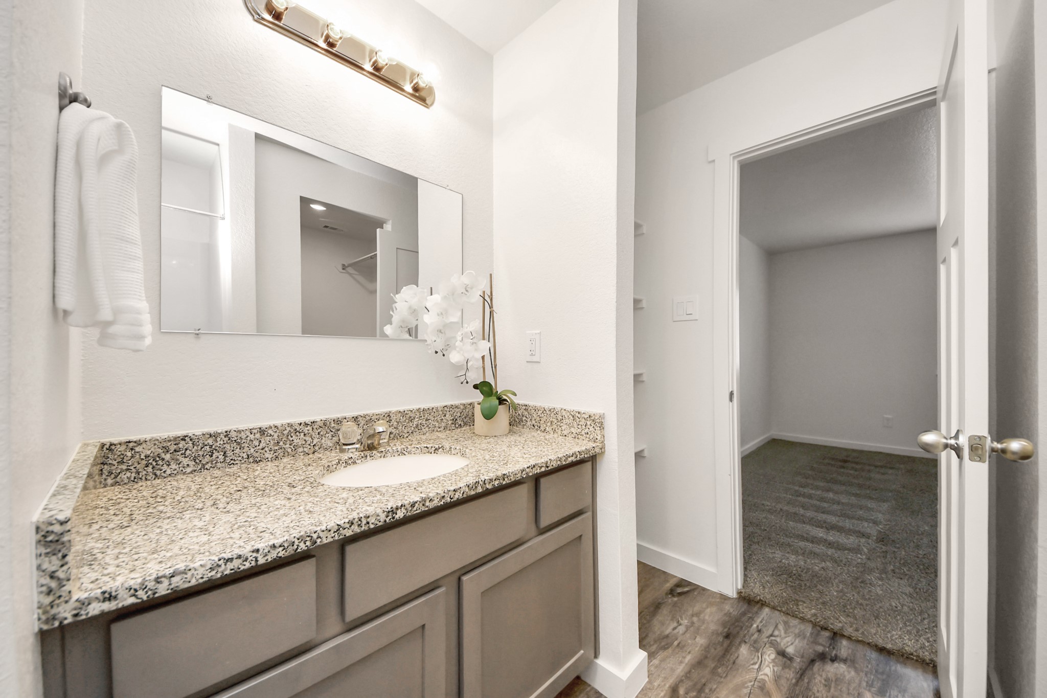 21155 Gosling Road, Unit 40 Spring, TX 77388 - Photo 19 of 33 a bathroom with a granite countertop sink and a mirror
