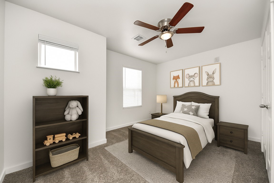 21155 Gosling Road, Unit 40 Spring, TX 77388 - Photo 21 of 33 a bedroom with a bed and a ceiling fan