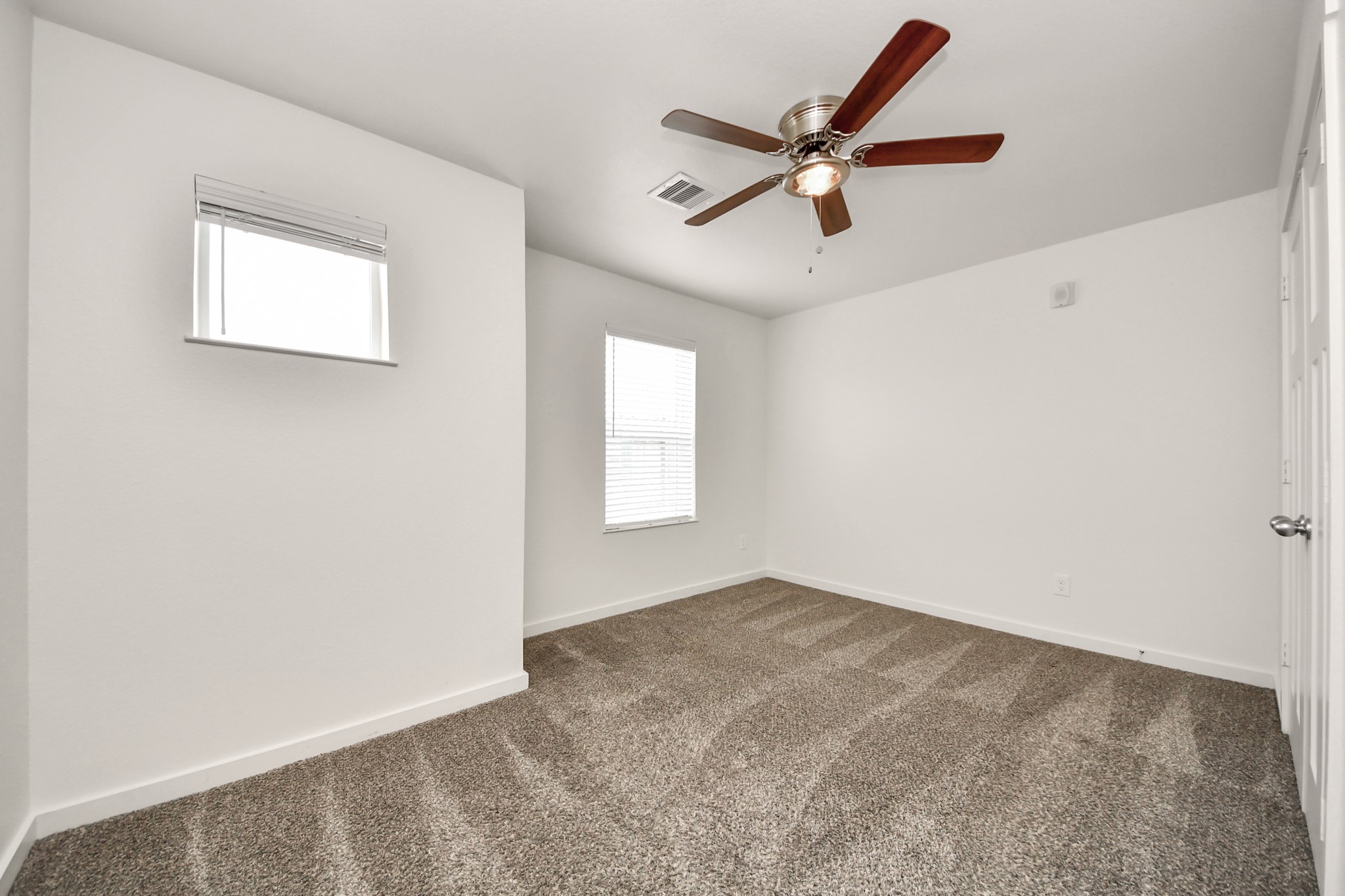 21155 Gosling Road, Unit 40 Spring, TX 77388 - Photo 22 of 33 an empty room with a window and a fan
