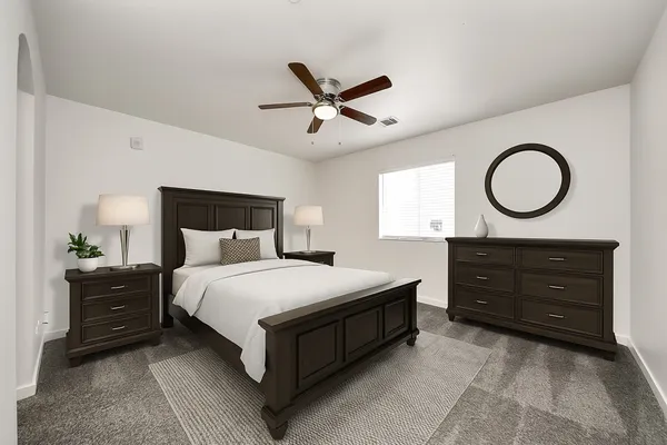 a bedroom with a bed and window