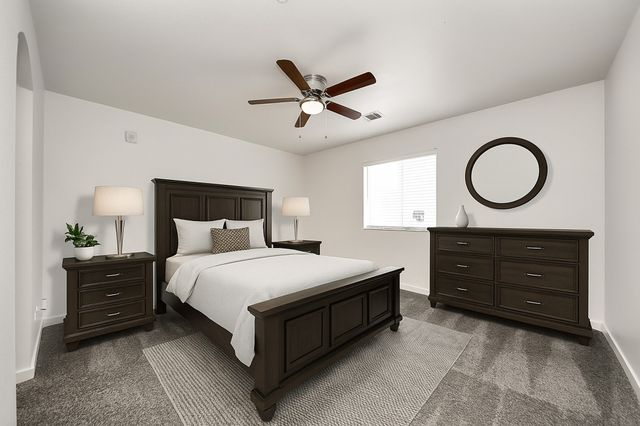 a bedroom with a bed and window