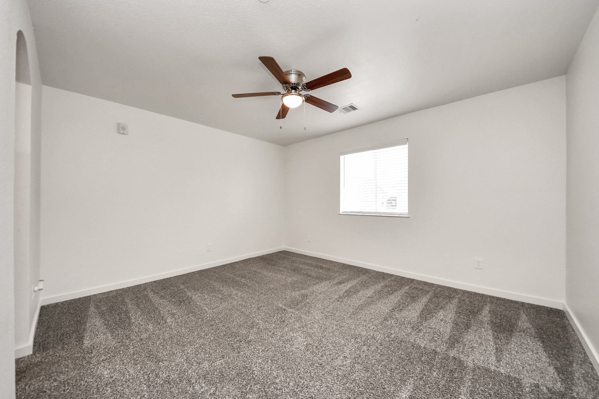 21155 Gosling Road, Unit 40 Spring, TX 77388 - Photo 27 of 33 an empty room with windows and fan