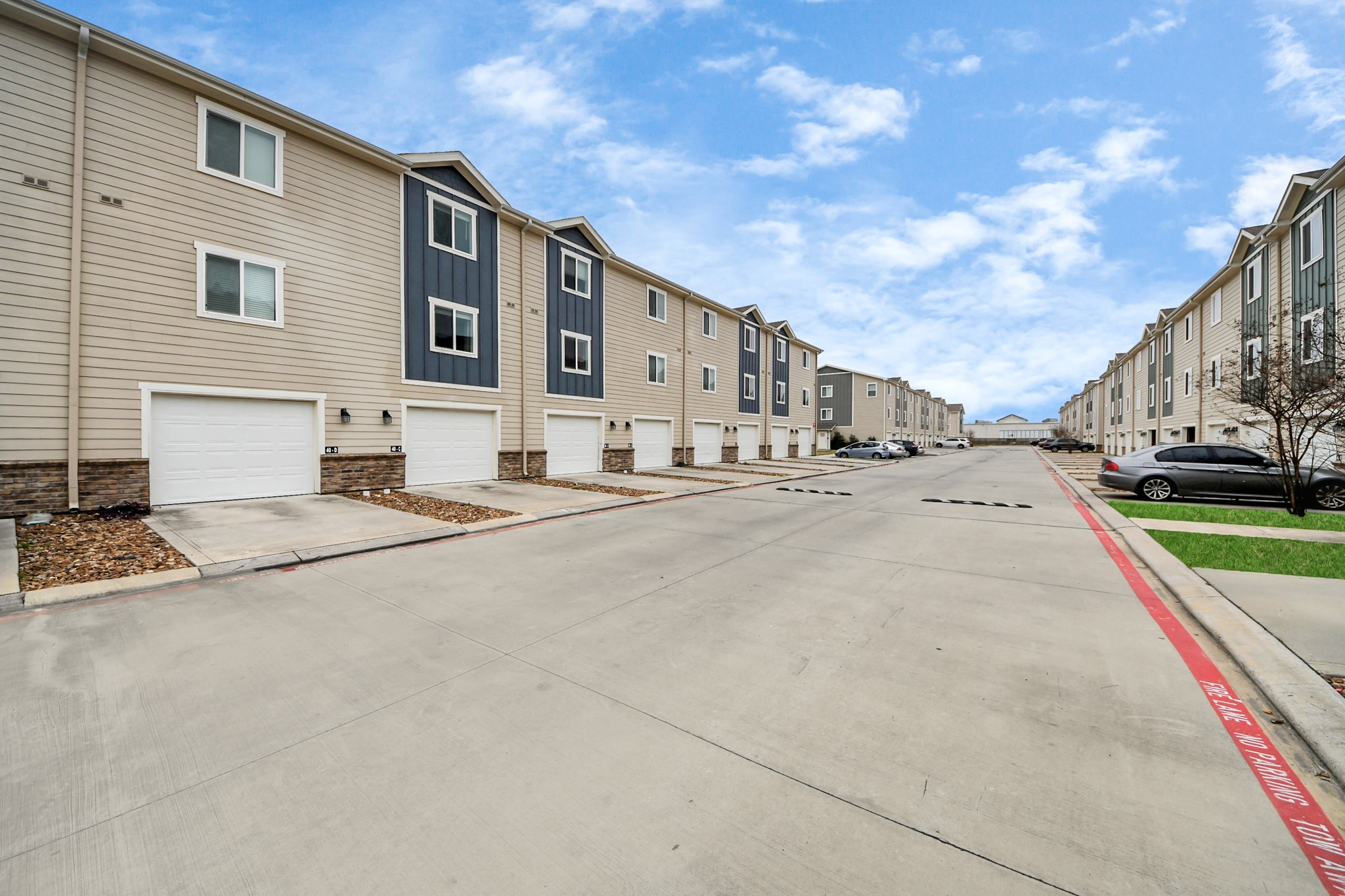 21155 Gosling Road, Unit 40 Spring, TX 77388 - Photo 4 of 33 a street view with couple of cars parked in front of house
