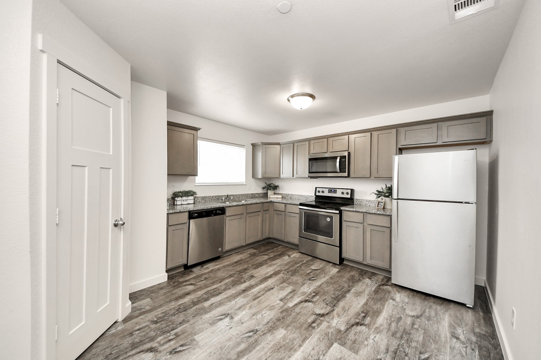 21155 Gosling Road, Unit 40 Spring, TX 77388 - Photo 9 of 33 a kitchen with a refrigerator stove and microwave