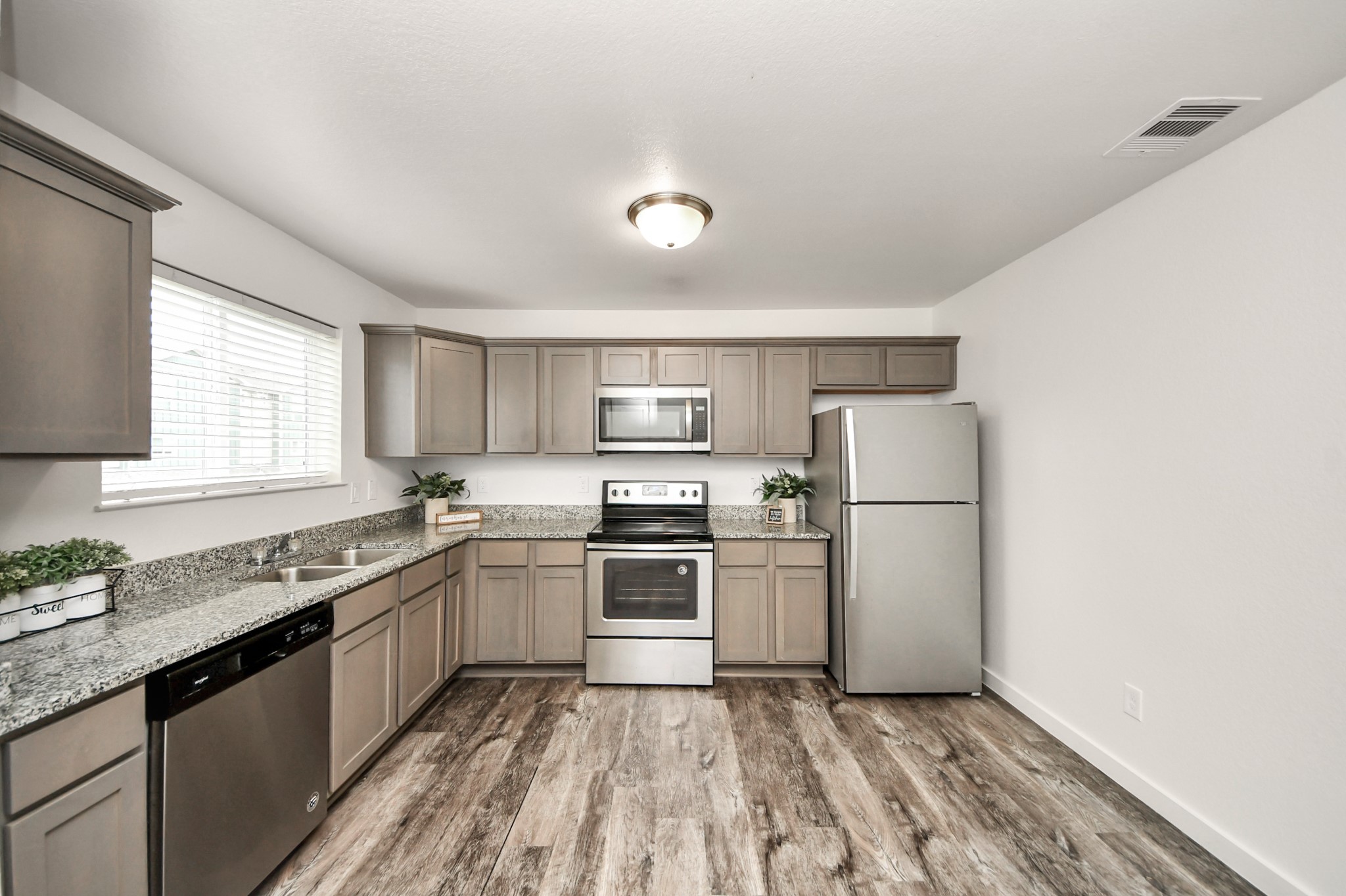 21155 Gosling Road, Unit 40 Spring, TX 77388 - Photo 10 of 33 a kitchen with a sink a stove and refrigerator