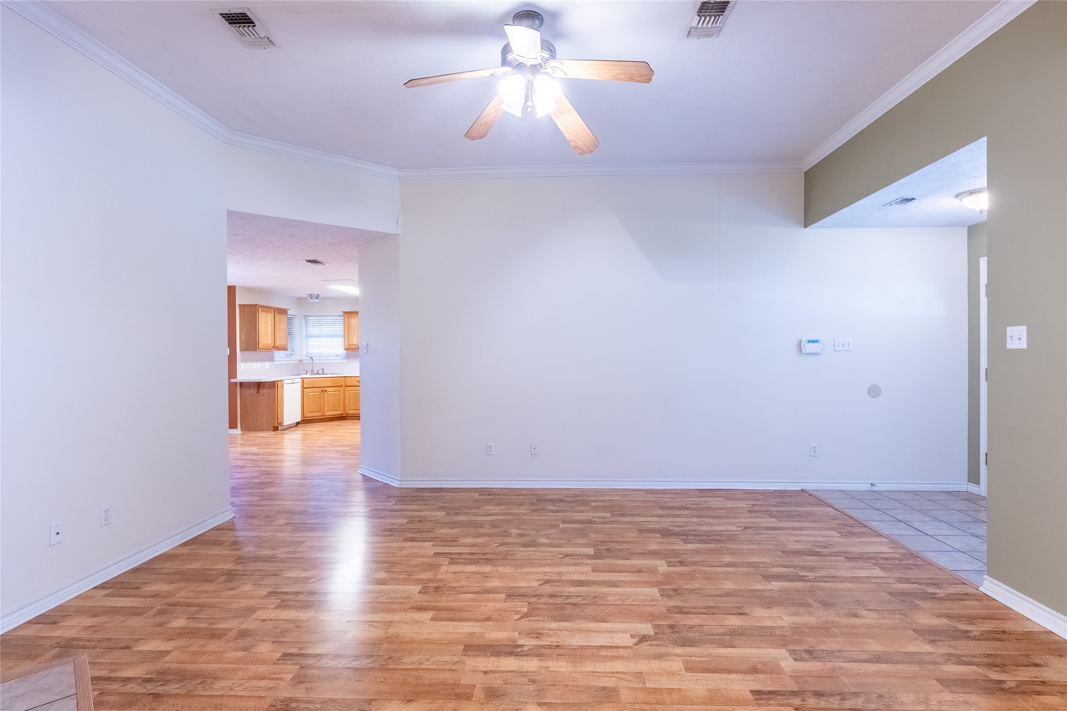 4802 Treadgold Lane Bryan, TX 77802 - Photo 9 of 27 a view of an empty room and window and wooden floor