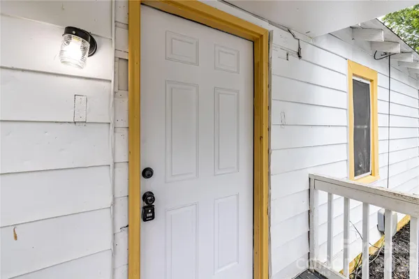 a view of a door with wooden floor