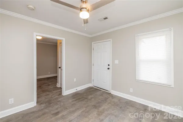 a view of an empty room with a window