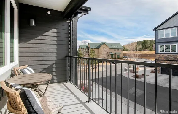 a view of a balcony with furniture