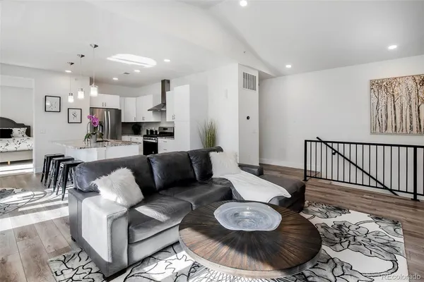 a living room with furniture and a rug