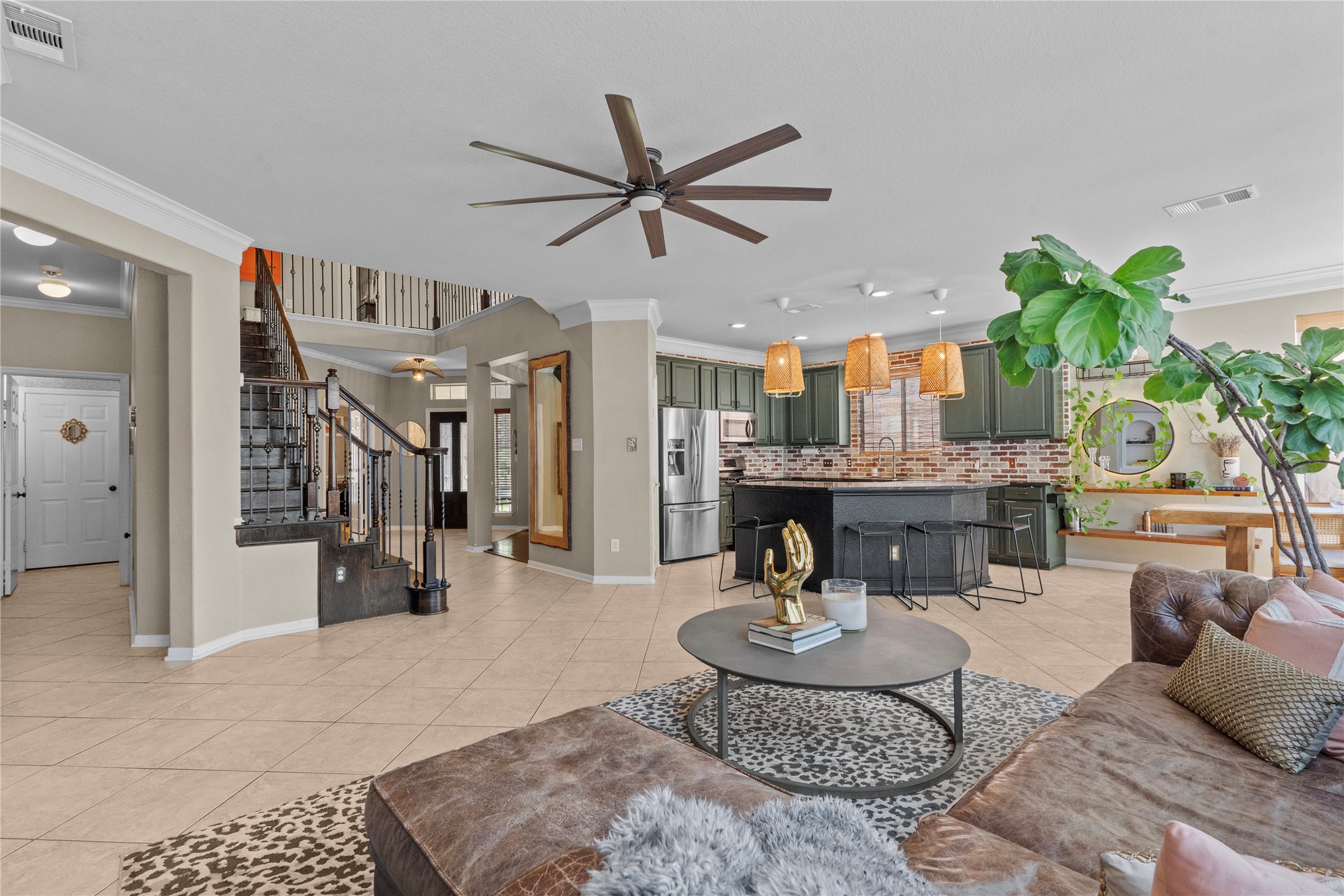 11514 Senna Ledge Court Houston, TX 77089 - Photo 11 of 48 a living room with furniture and a chandelier