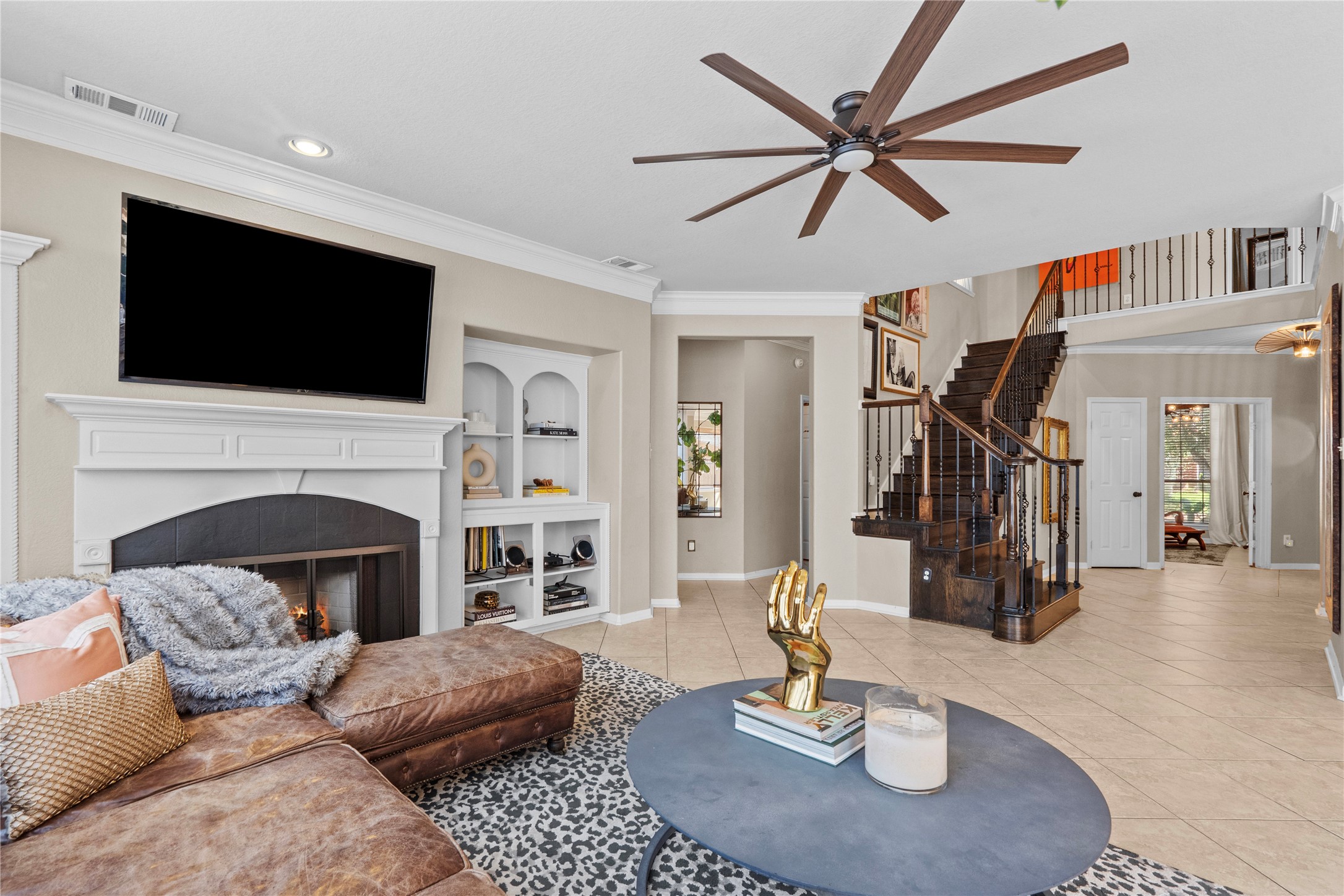 11514 Senna Ledge Court Houston, TX 77089 - Photo 12 of 48 a living room with furniture a fireplace and flat screen tv