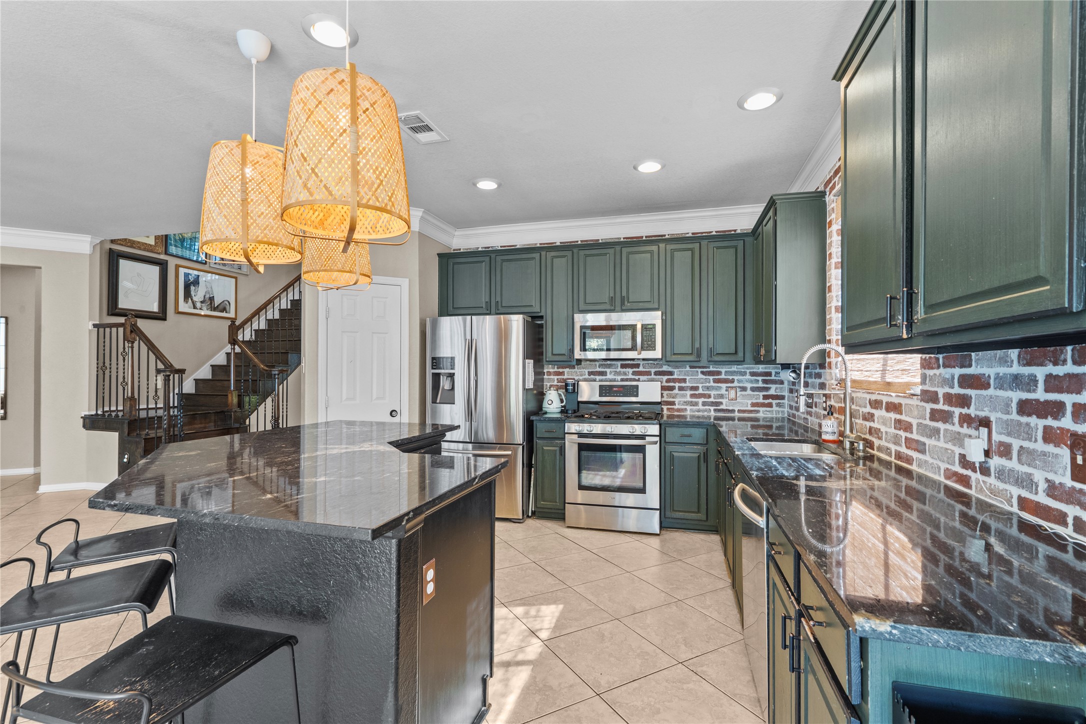 11514 Senna Ledge Court Houston, TX 77089 - Photo 14 of 48 a kitchen with stainless steel appliances granite countertop a sink stove and refrigerator
