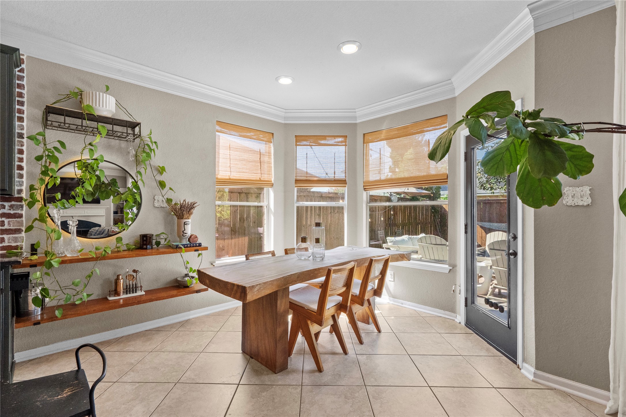 11514 Senna Ledge Court Houston, TX 77089 - Photo 16 of 48 a dining room with furniture and large windows