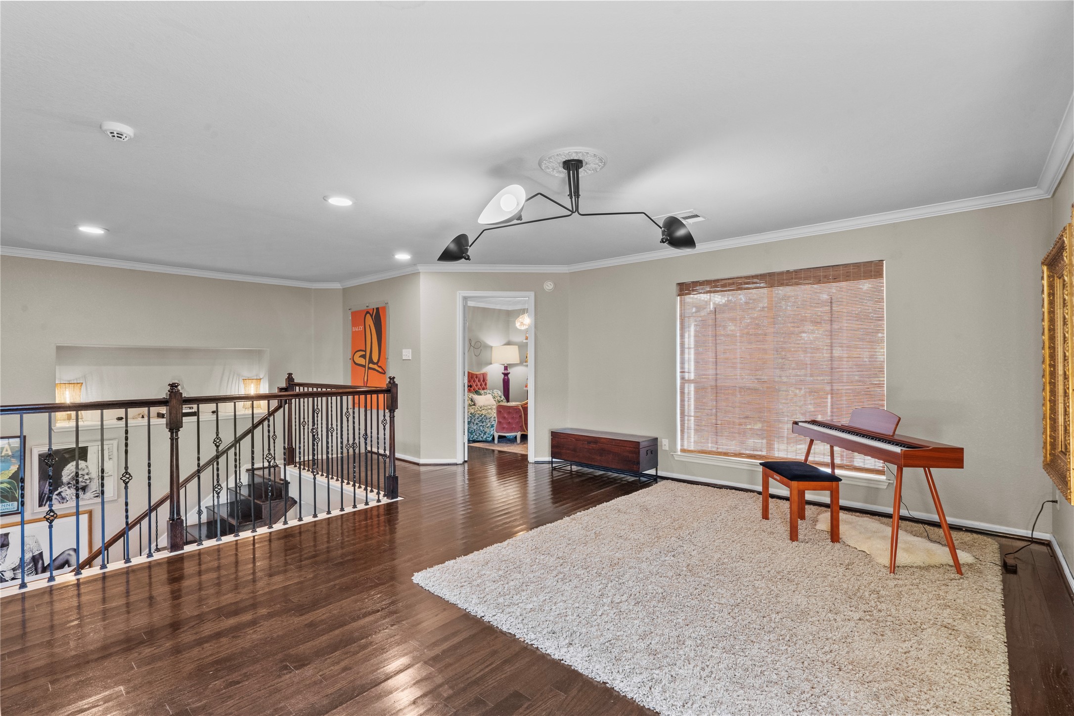 11514 Senna Ledge Court Houston, TX 77089 - Photo 23 of 48 a view of a hallway with wooden floor and furniture