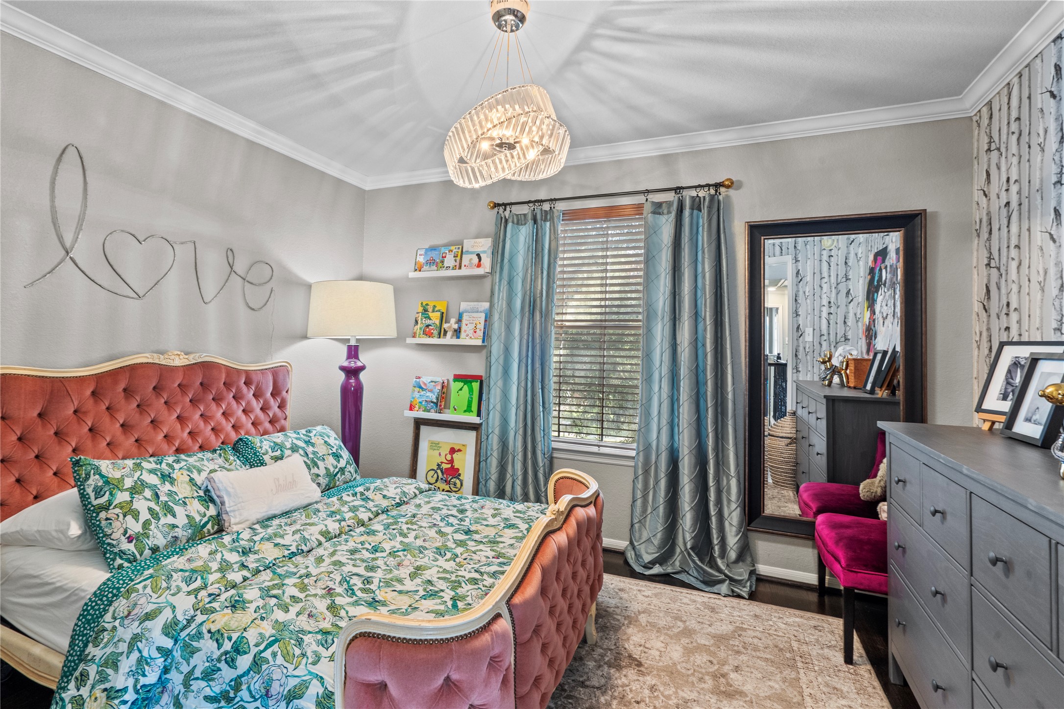 11514 Senna Ledge Court Houston, TX 77089 - Photo 24 of 48 a bedroom with a bed and a chandelier