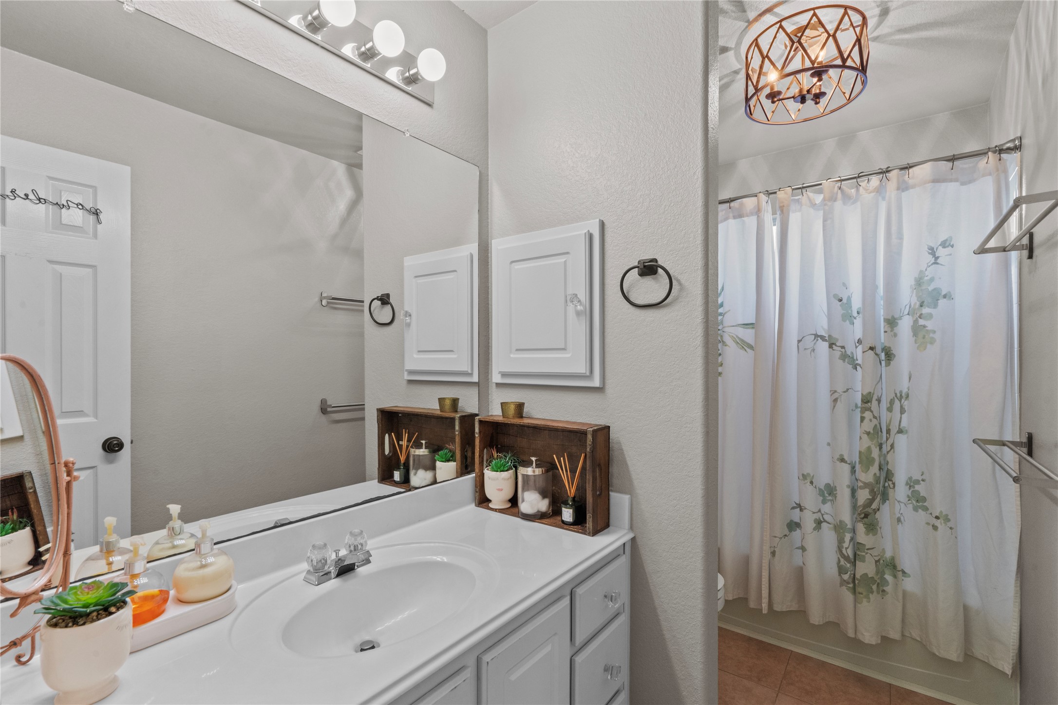 11514 Senna Ledge Court Houston, TX 77089 - Photo 26 of 48 a bathroom with a sink vanity granite tub shower and a mirror