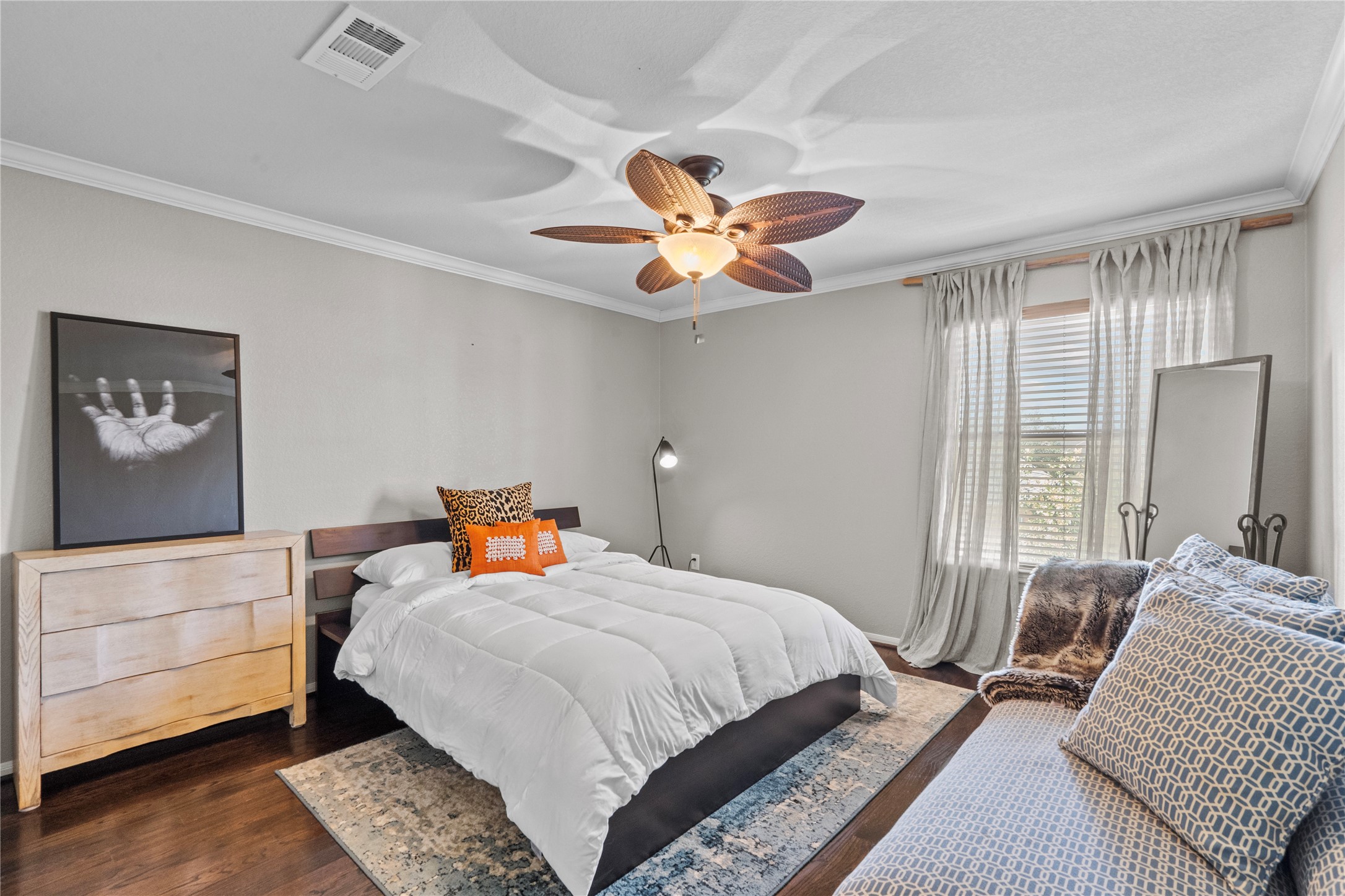 11514 Senna Ledge Court Houston, TX 77089 - Photo 27 of 48 a bedroom with a bed and a chandelier