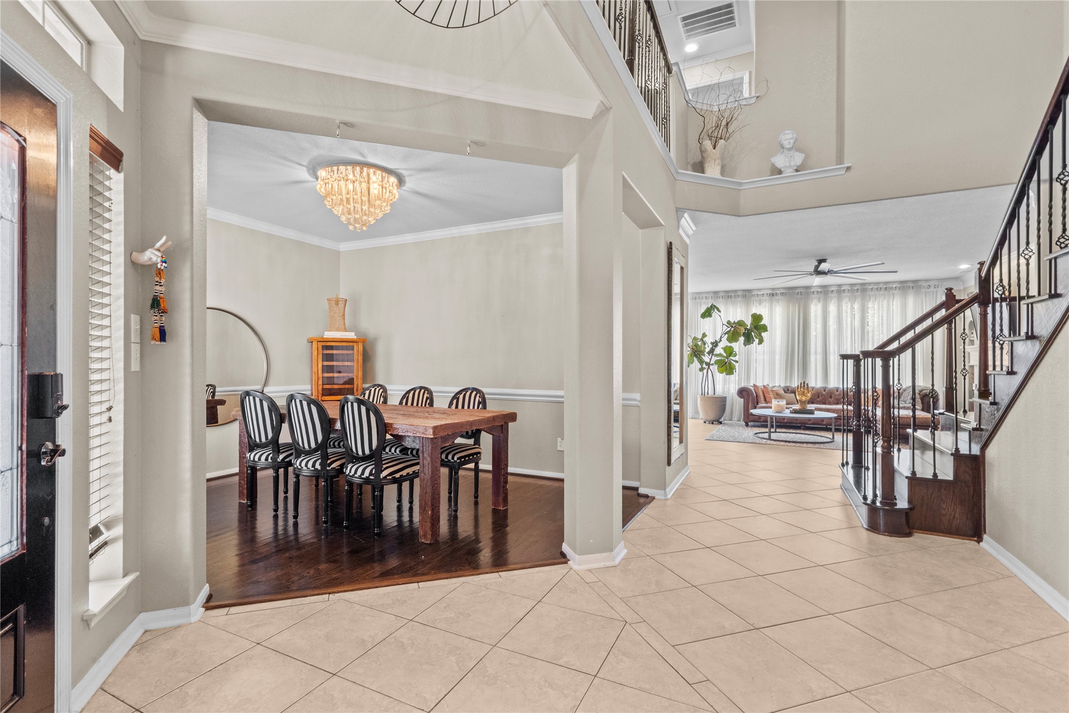 11514 Senna Ledge Court Houston, TX 77089 - Photo 3 of 48 a view of a dining area with furniture and a chandelier