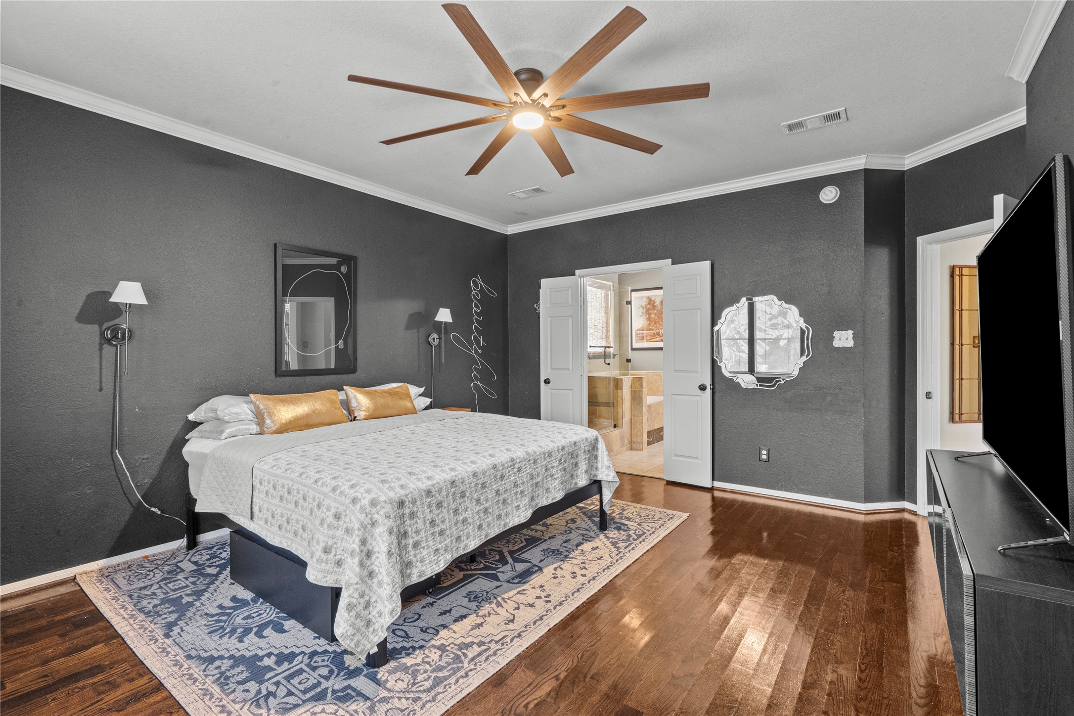 11514 Senna Ledge Court Houston, TX 77089 - Photo 31 of 48 a bedroom with a bed and a flat screen tv