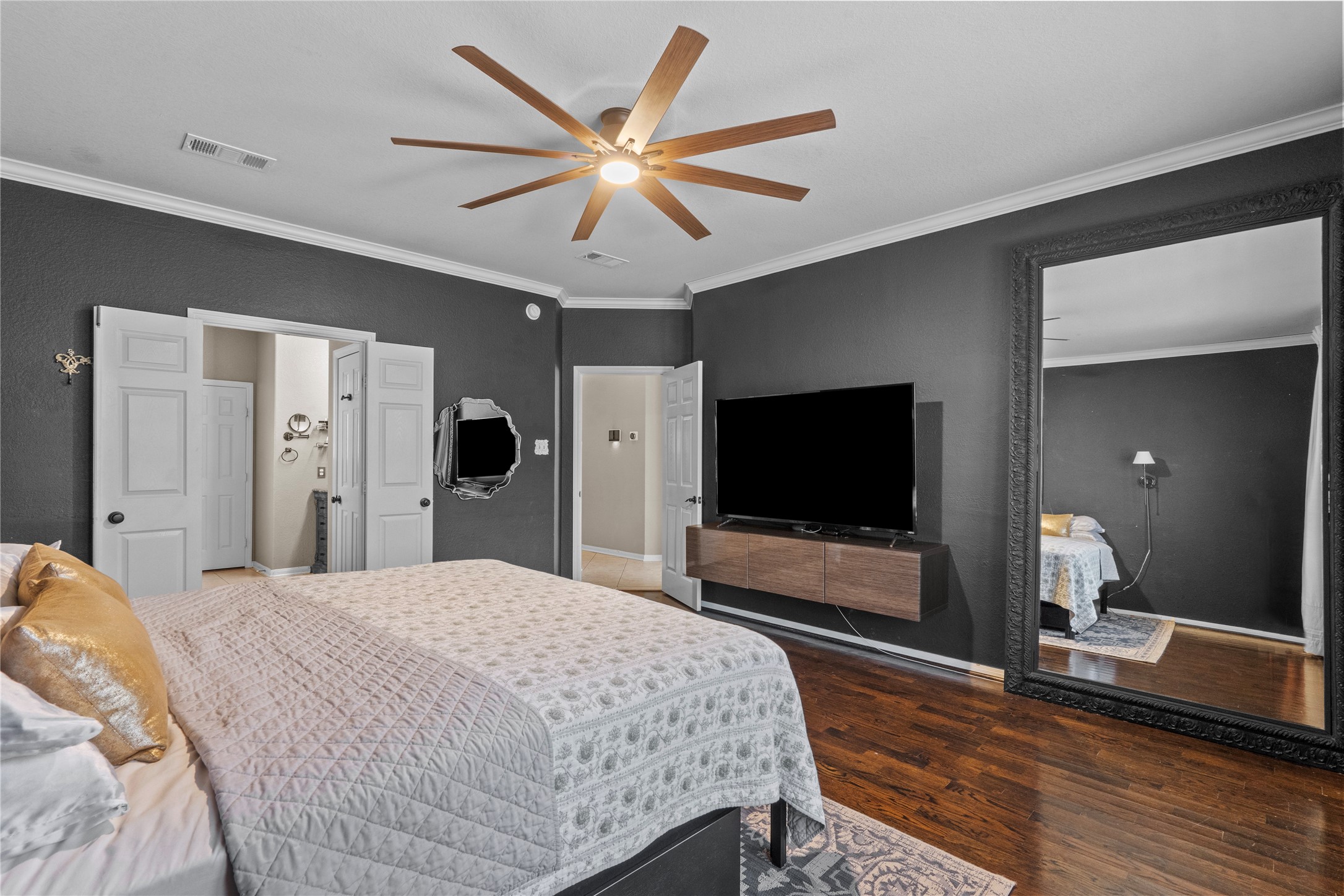 11514 Senna Ledge Court Houston, TX 77089 - Photo 32 of 48 a bedroom with a bed and a flat screen tv