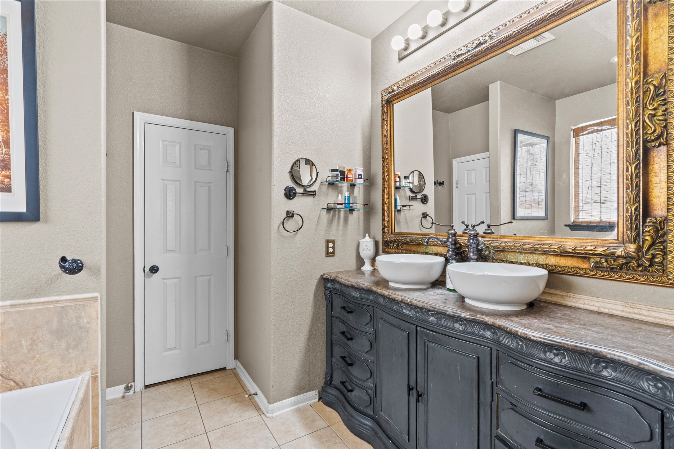 11514 Senna Ledge Court Houston, TX 77089 - Photo 34 of 48 a bathroom with a granite countertop sink and a mirror