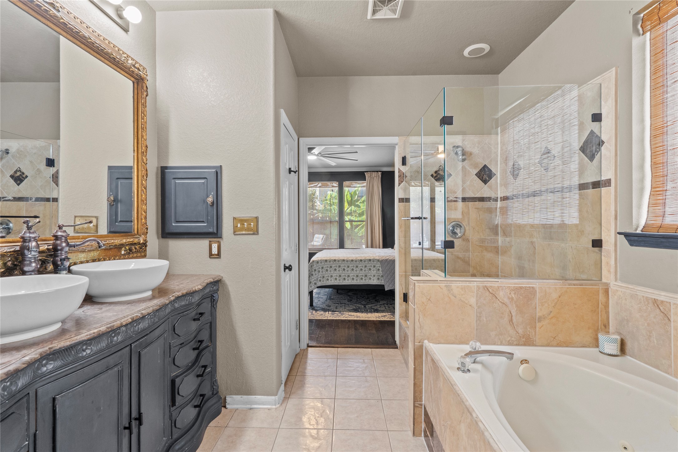 11514 Senna Ledge Court Houston, TX 77089 - Photo 35 of 48 a bathroom with a granite countertop sink a toilet and shower