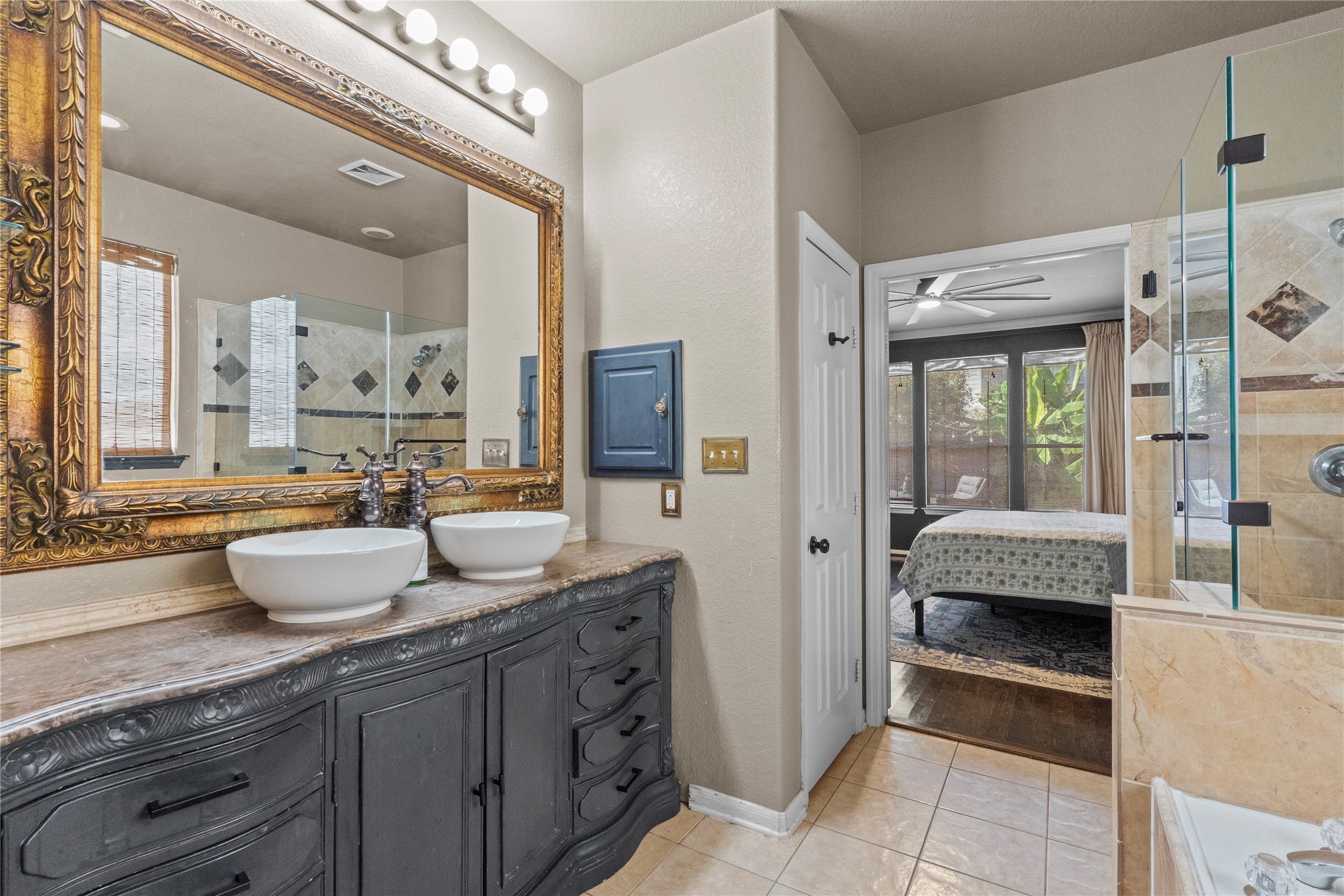 11514 Senna Ledge Court Houston, TX 77089 - Photo 36 of 48 a bathroom with a double vanity sink and a mirror