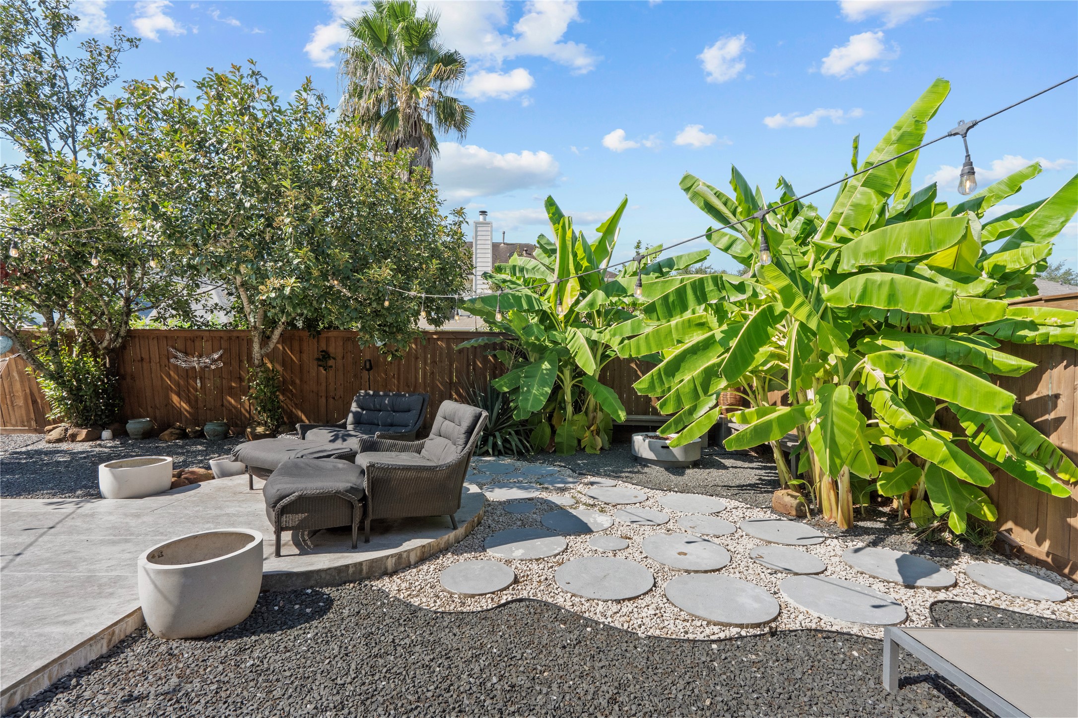 11514 Senna Ledge Court Houston, TX 77089 - Photo 39 of 48 a view of a backyard with chair and potted plants