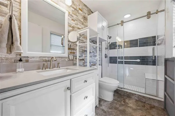 a bathroom with a sink and a toilet