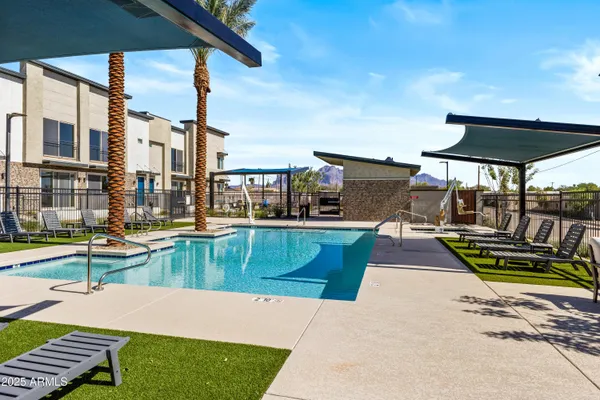 a view of a swimming pool with a lounge chairs
