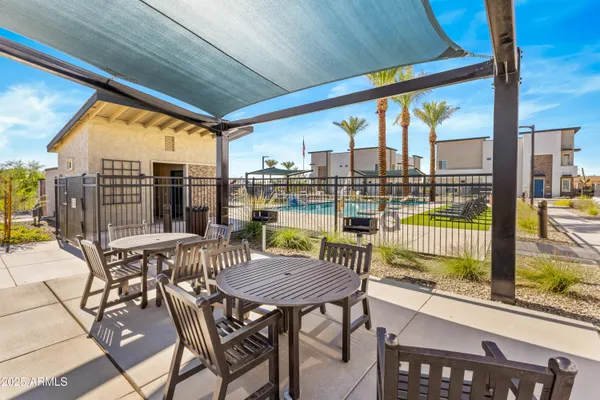 a view of a patio with a table chairs and glass door