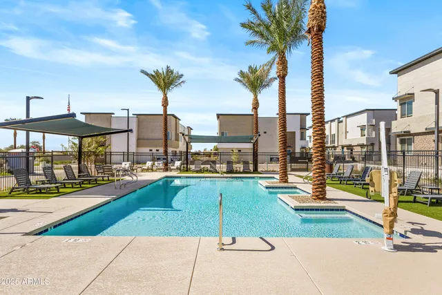 a view of a swimming pool with a lounge chairs