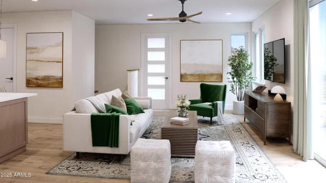 a kitchen with stainless steel appliances granite countertop a refrigerator a sink dishwasher a stove a microwave oven a sink with island and chairs