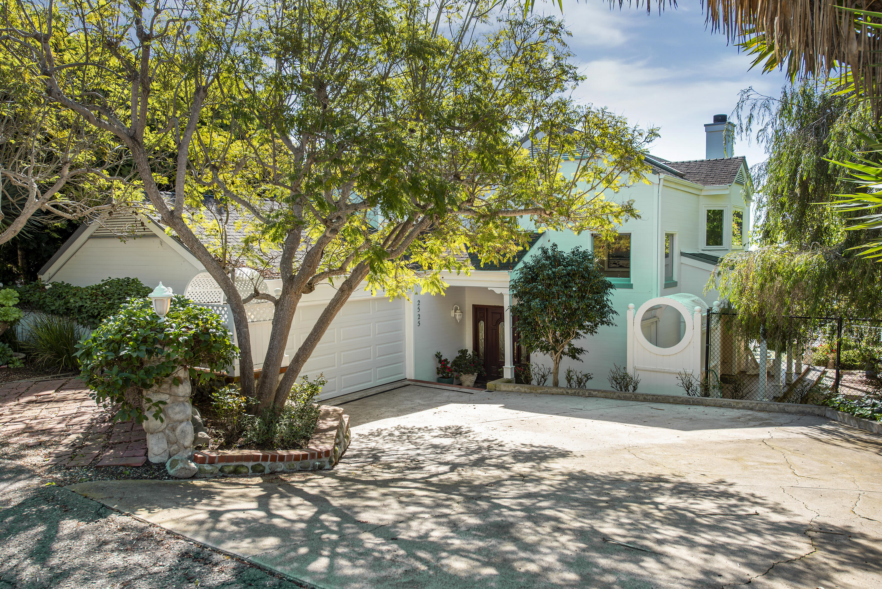 2525 Emerson Street Summerland, CA 93067 - Photo 3 of 26 a backyard of a house with table and chairs