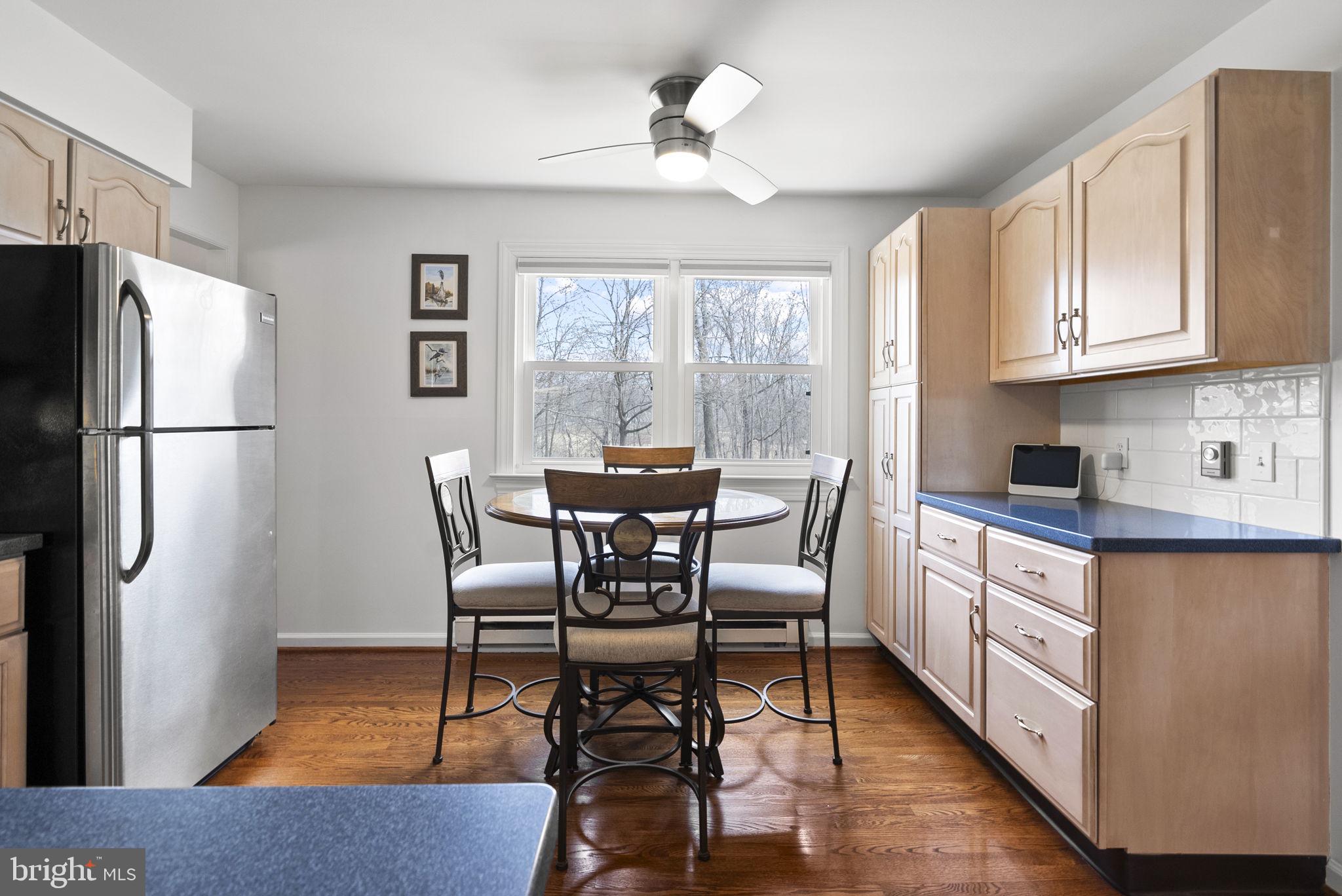 222 Brookside Circle Harleysville, PA 19438 - Photo 12 of 34 a kitchen with stainless steel appliances granite countertop a refrigerator a stove a sink dishwasher and white cabinets with wooden floor