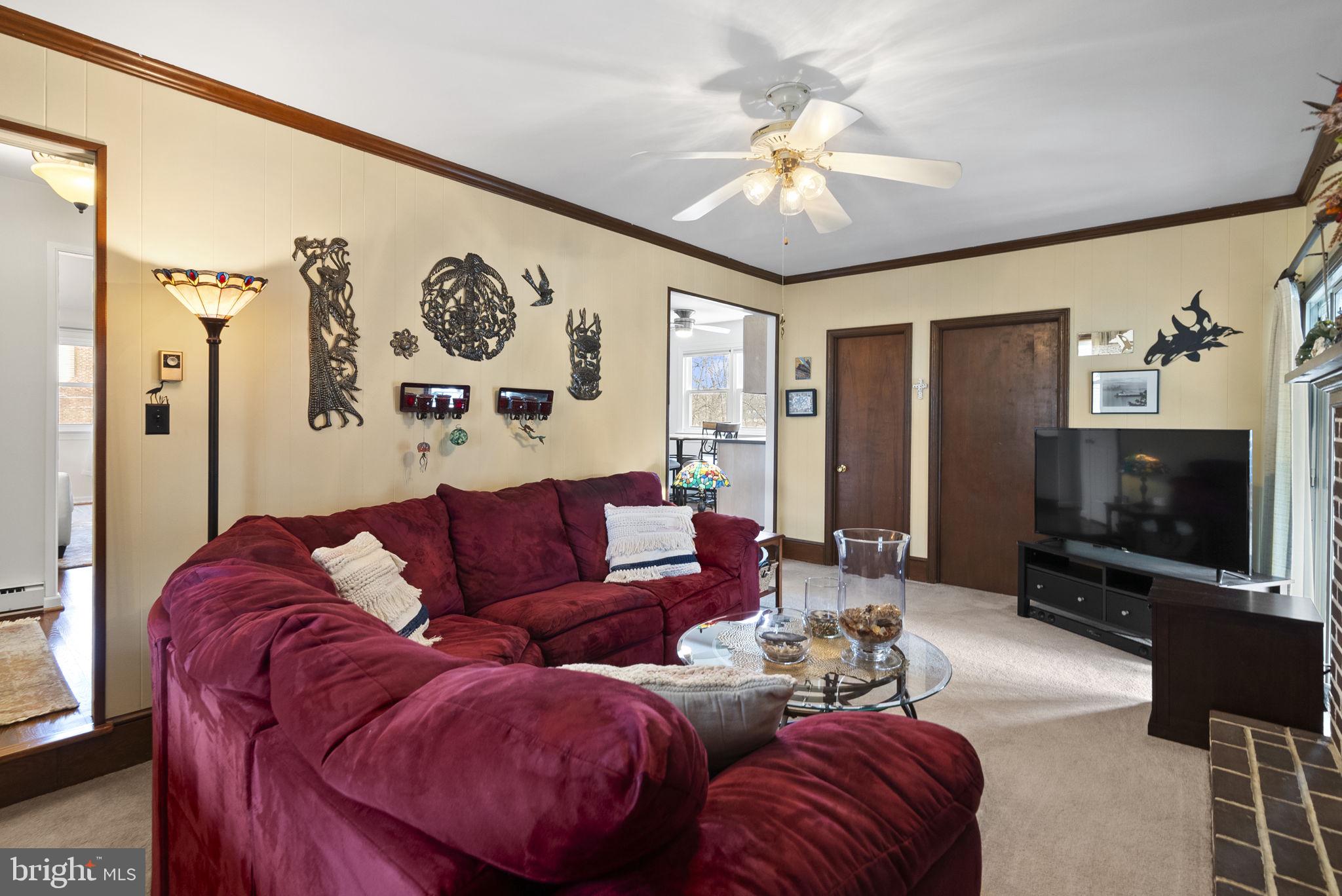 222 Brookside Circle Harleysville, PA 19438 - Photo 13 of 34 a living room with furniture and a flat screen tv