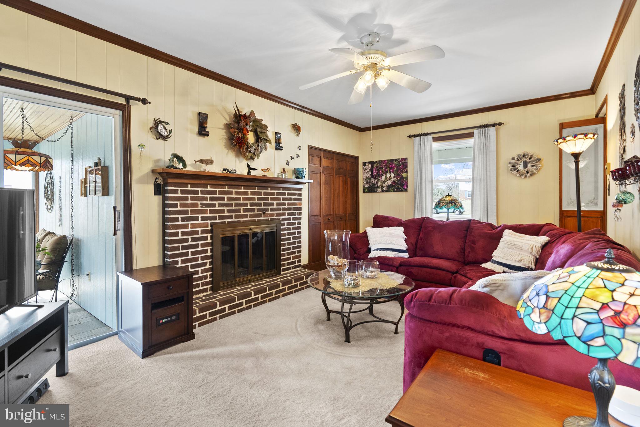 222 Brookside Circle Harleysville, PA 19438 - Photo 14 of 34 a living room with furniture and a fireplace