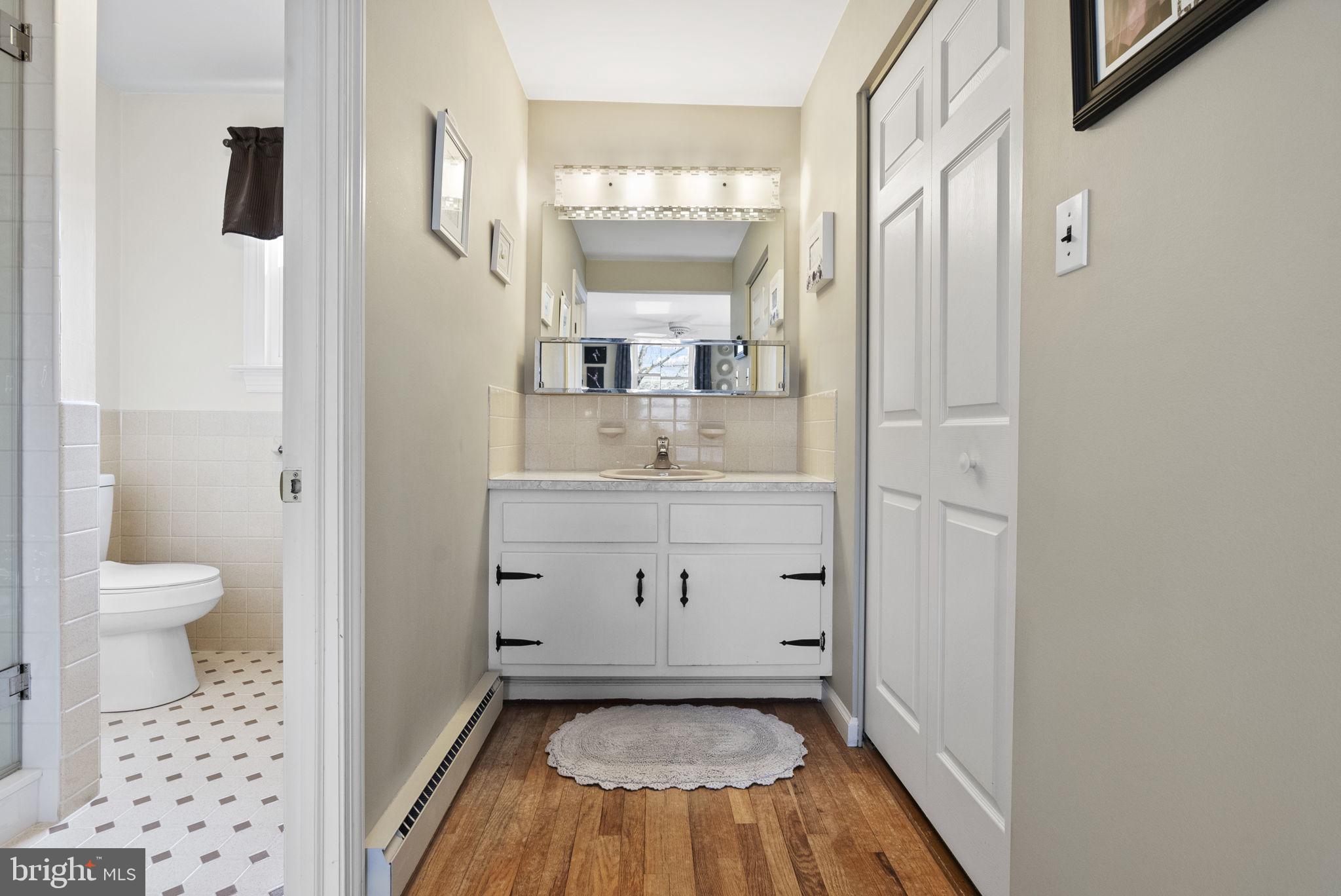 222 Brookside Circle Harleysville, PA 19438 - Photo 22 of 34 a bathroom with a sink toilet and shower
